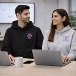 Classic cotton black hoodie worn by model in posed setting suitable for corporate gifting and employee welcome kits