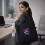 Classic cotton tote bag black shown in everyday use setting suitable for corporate gifting and employee welcome kits