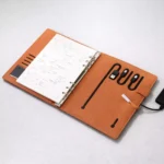 Tan diary style 5000mAh power bank with open cover design suitable for corporate gifting and employee welcome kits