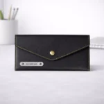 Black leather ladies clutch purse with multiple compartments suitable for corporate gifting and employee welcome kits