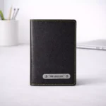 Black leather passport organiser with multiple slots suitable for corporate travel gifting and employee welcome kits