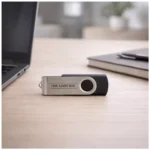 Classic swivel pendrive placed on office desk suitable for corporate gifting and employee welcome kits