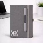 Grey PU fabric A5 diary with pen holder and 192 pages suitable for corporate gifting and employee welcome kits