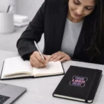 Premium fabric strap notebook shown with model suitable for corporate gifting and employee welcome kits