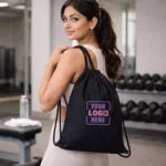 Signature cotton drawstring bag shown with model carrying it suitable for corporate gifting and employee welcome kits