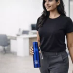 Signature steel bottle blue 700 ml held in hand suitable for corporate gifting and employee welcome kits