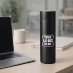 Smart sensor bottle black 500 ml placed on office desk suitable for corporate gifting and employee welcome kits