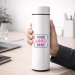 Smart sensor bottle white 500 ml placed on office desk suitable for corporate gifting and employee welcome kits