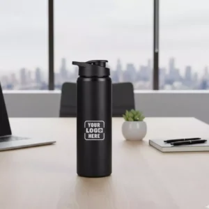 Sporty steel water bottle black 750 ml placed on office desk suitable for corporate gifting and employee welcome kits