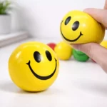 Yellow smiley stress relief ball suitable for employee welcome kits and corporate gifting