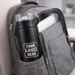 Vacuum insulated bottle 500 ml with cup lid placed inside office bag suitable for corporate gifting and employee welcome kits