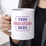 White ceramic coffee mug 325ml held in hand showcasing printable area for corporate gifting and employee welcome kits