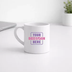White ceramic tea mug 175 ml placed on office desk with custom print area for corporate gifting and employee welcome kits
