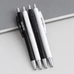 Ticker Plastic Ball Pen with black and white plastic body options and silver-tone accents for corporate gifting